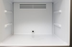 Why Does a Blocked Defrost Drain Cause Leaks